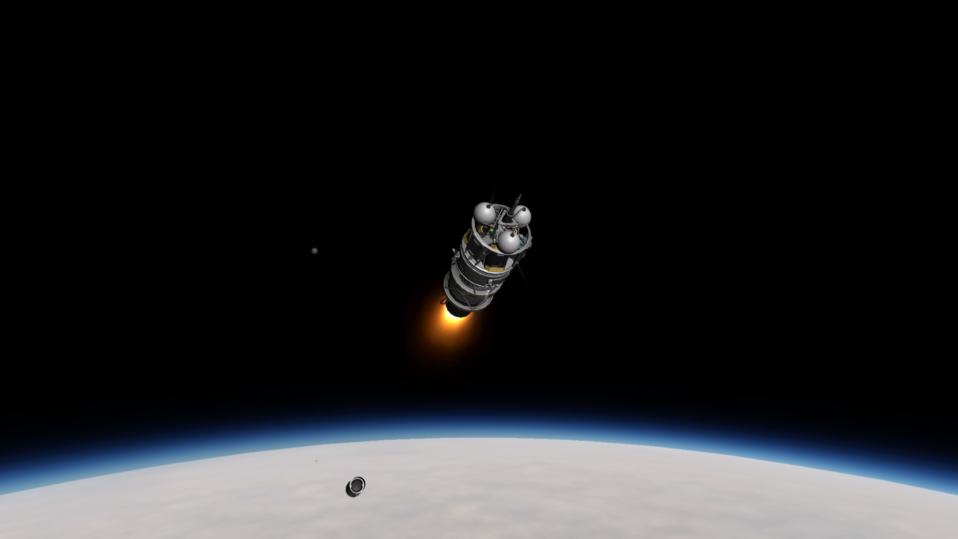 The second booster ignites, carrying a cylindrical and spindly probe towards orbit.