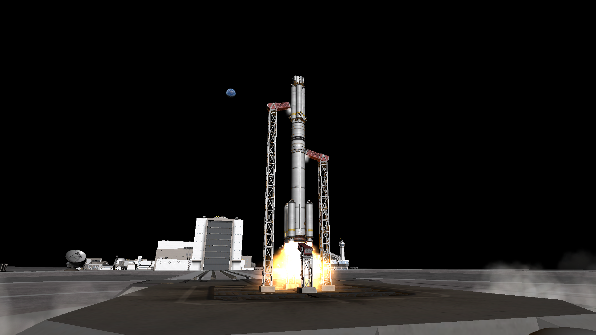 An octagonal spacecraft similar to the original Outreach 1 vehicle atop a rocket consisting of a bundle of four solid rocket motors, a squat wide solid rocket motor, one long solid rocket motor, and four small boosters takes off from the pad. A gibbous Kerbmun can be seen in the background.