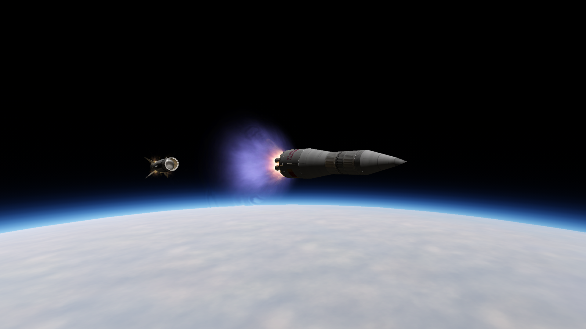 The central core flying backwards as the six-engine upper stage fires, pointed almost horizontally.