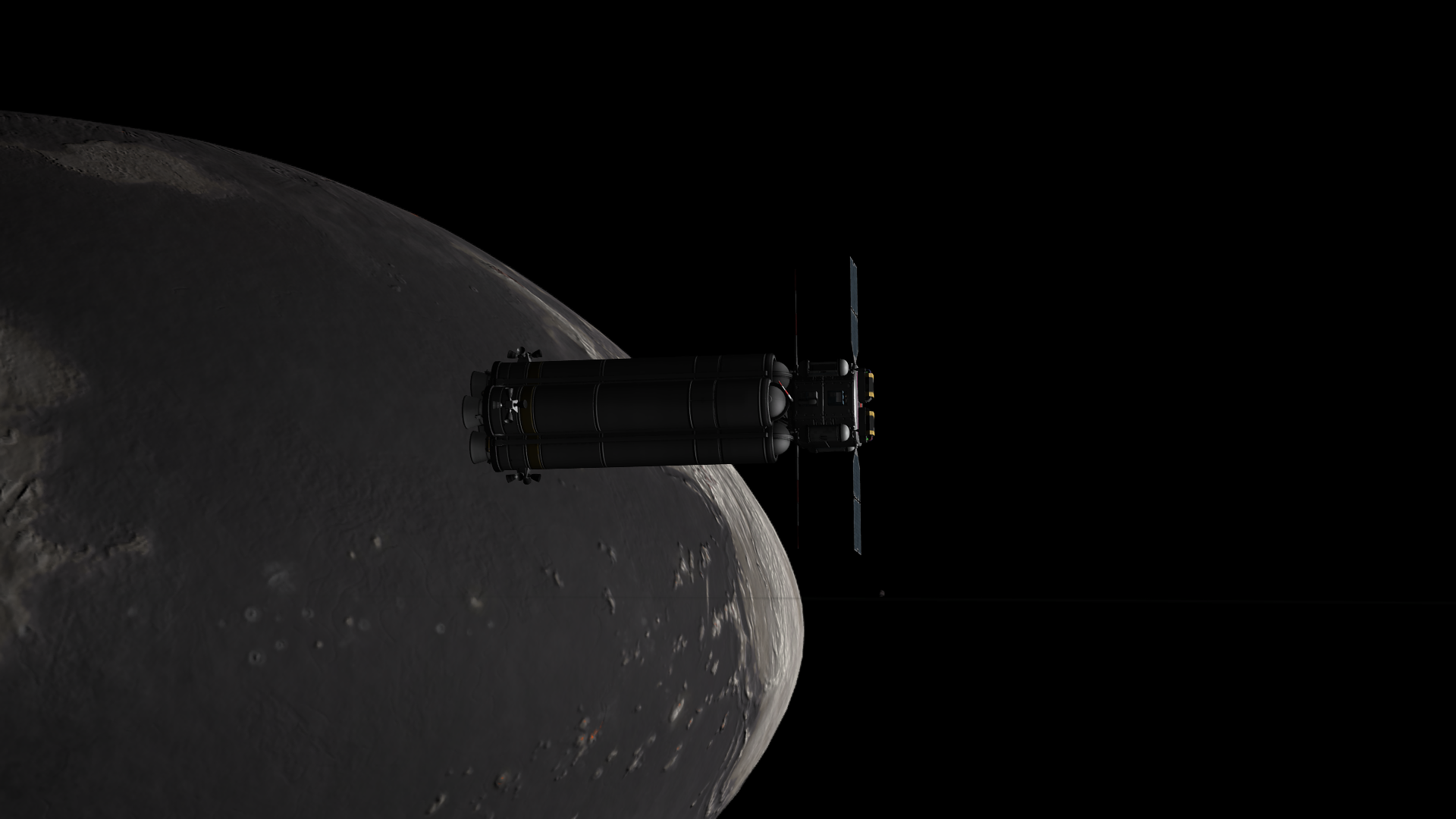 The stunning contrast of Mesbin, basalt seas and light continents at once similar to Graymun and vastly different. Many islands and small light craters are visible, especially towards the football or lentil-like rim. Barely visible, a hair's-breadth thread, are the rings cutting across Mesbin. Thresomin is visible as a small greyish blob near the center of the image.